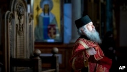 A Georgian Orthodox priest conducts a Mass at Trinity Cathedral in Tbilisi.