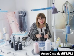 Anda Manescu works in her store in Breaza, north of Bucharest.