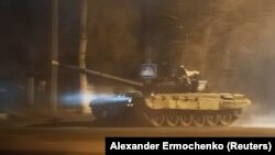 UKRAINE -- A tank drives along a street in the city of Donetsk in eastern Ukraine, February 22, 2022