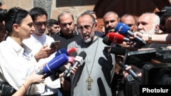 Mikael Ajapahyan, head of the Shirak Diocese of the Armenian Apostolic Church, speaks to reporters at the Mother See of Holy Etchmiadzin on June 27, 2025.