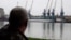 Plauru resident Gheorghe Puflea looks across the Danube at the Ukrainian port of Izmail.