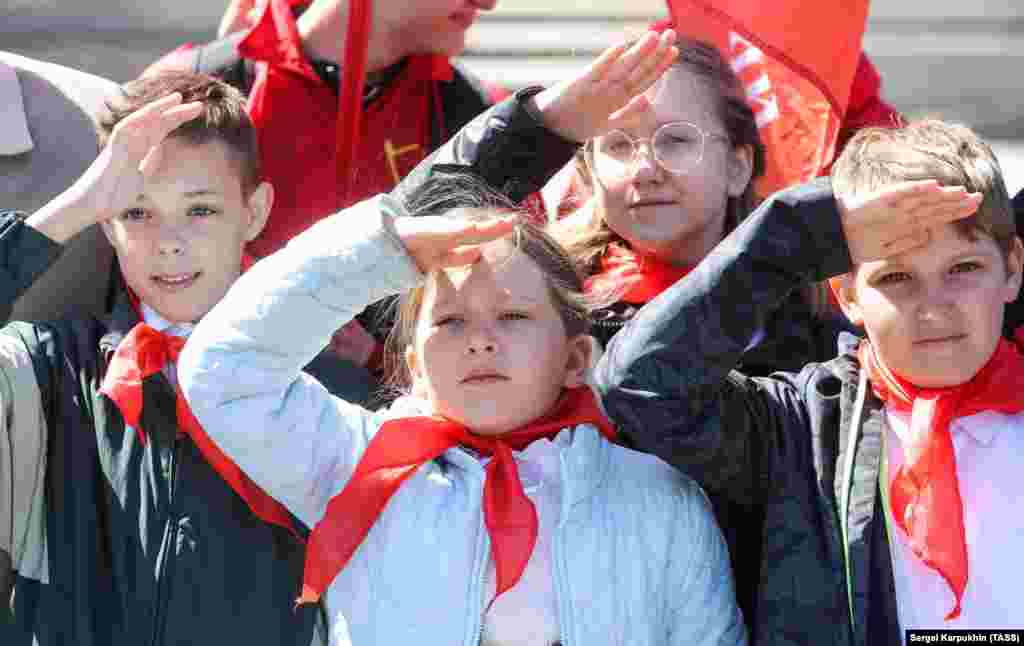 Schoolchildren give the Pioneer salute on Red Square on May 22.&nbsp; Afonin says of the Kremlin's Big Change initiative, which plans to enlist millions of children into the Pioneer-like youth group: "There is no need to unite. It is important that different organizations develop."