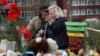 A woman reacts at the site of a deadly Russian missile strike on a residential area in Kryviy Rih that killed several children and adults on April 4.