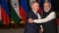 Indian Prime Minister Narendra Modi (right) greets Russian President Vladimir Putin before a meeting at Hyderabad House in New Delhi on December 6, 2021.