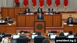 Kyrgyz President Sadyr Japarov peaks in parliament in June.
