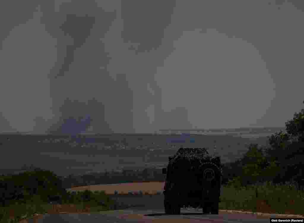 Smoke rises in the distance following an artillery barrage in the Donetsk region. Ukrainian President Volodymyr Zelenskiy noted the attacks on Kharkiv, Kramatorsk, and other cities of the Donbas in his&nbsp;nightly video address&nbsp;on July 7 and said Ukraine&rsquo;s partners have accurate information about its defense needs. &ldquo;The greater the defense aid to Ukraine now, the sooner the war will end with our victory and the less the losses of all countries of the world, the losses of the United States from Russian pressure on democratic societies," Zelenskiy said.