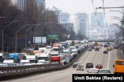 Residents leave central Kyiv on February 24.