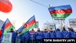 Azerbaijani pro-government activists block a road connecting Nagorno-Karabakh to Armenia, December 26, 2022.