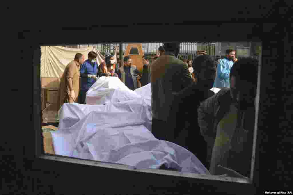 People identify the bodies of relatives killed in the suicide bombing. &nbsp;