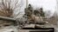 Ukraine - Pro-Russian pro-Russian troops are seen atop of a tank in the separatist-controlled settlement of Buhas (Bugas), in the Donetsk region, Ukraine March 1, 2022. 