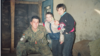 Spanish UN peacekeeper Salvadoro Andres Pelaez with 8-year-old Haris Behram and his cousin, 11-year-old Almir Behram, in a 1993 photo from Mostar, Bosnia-Herzegovina. 