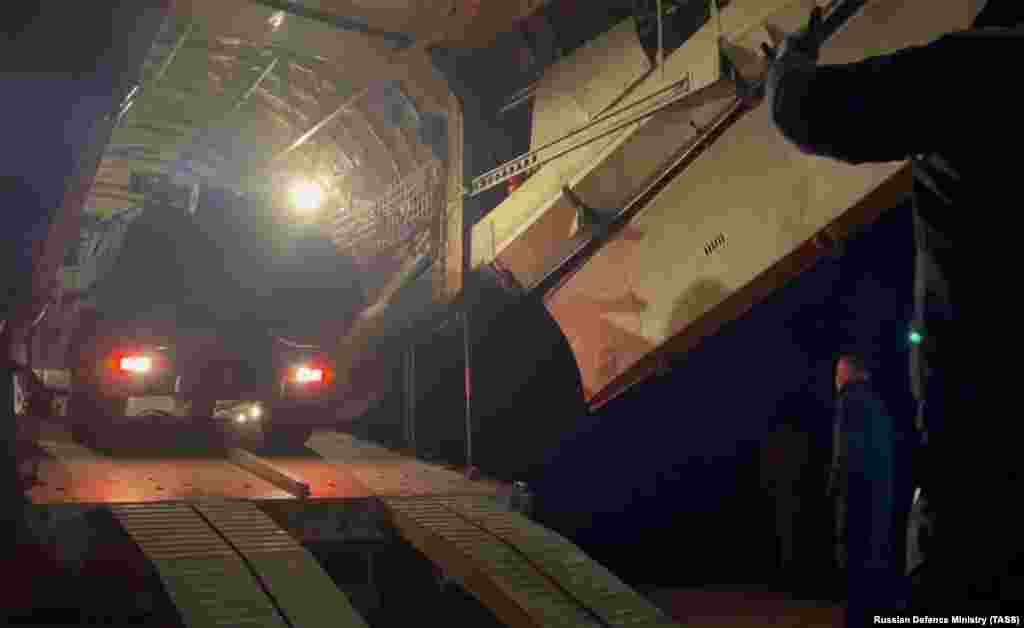 A vehicle being unloaded from a Russian transport plane at an unspecified location in Kazakhstan on the evening of January 6.