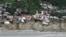 Flood-damaged buildings along the Swat River in Pakistan. 