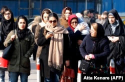 Iranian women wearing the compulsory hijab walk down a street in the capital, Tehran. (file photo)