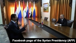 Президент Путин Хмеймимде Сирия президенти Башар Асад менен жолукту.
