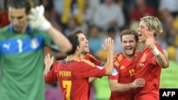 Spanish forward Fernando Torres (right) and teammates celebrate after winning the Euro 2012 football final 4-0 against Italy in Kyiv.