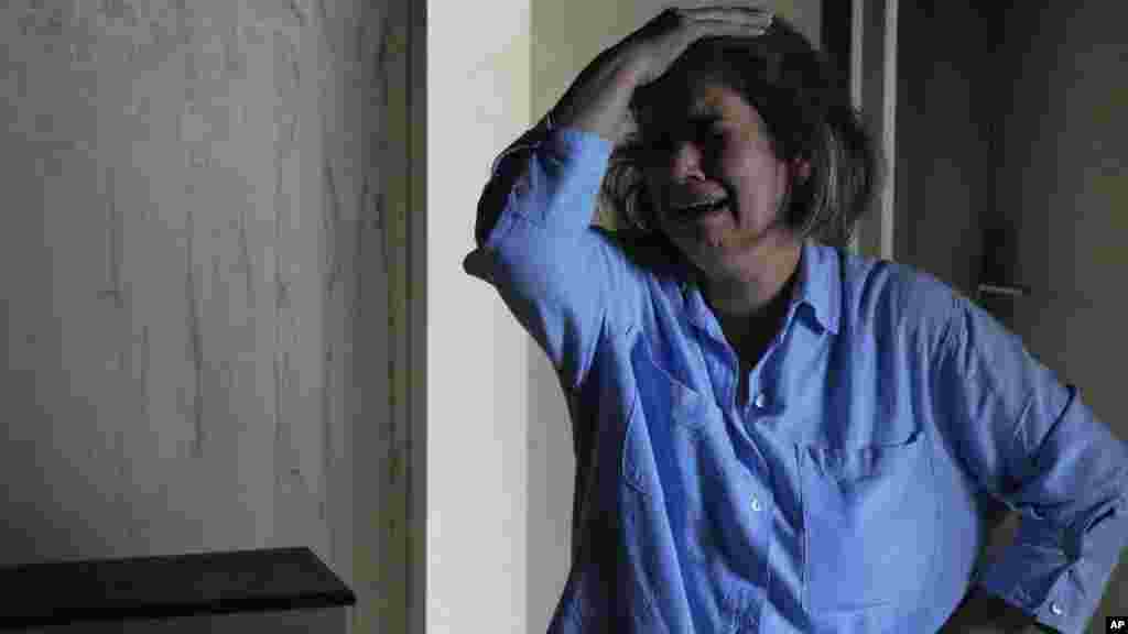 Iranka nakon što je njen dom oštećen u izraelskom napadu na Teheran.