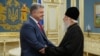 Ukrainian President Petro Poroshenko (left) meets with Patriarch Filaret, head of the Ukrainian Orthodox Church of the Kyiv Patriarchate, in Kyiv on October 11.