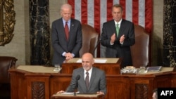 FILE: Afghan President Ashraf Ghani (C) is applauded by House Speaker John Boehner (R) and Vice President Joe Biden (L) as he addressed a joint session of Congress in Washington in March 2015.