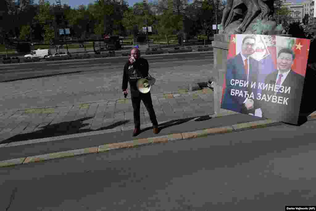 A protester outside Serbia&rsquo;s National Assembly alongside a sign showing Serbian President Aleksandar Vucic and President Xi that reads, &ldquo;Serbs And Chinese, Brothers Forever,&rdquo; on April 28. &nbsp; During a video summit this month, the EU announced a &ldquo;robust economic investment&rdquo; for Balkan countries, on top of the 3.3 billion euros ($3.6 billion) in emergency funding the EU had already earmarked for the region. &ldquo;The Western Balkans belongs in the EU and there is no question for us about it,&rdquo; European Commission President Ursula von der Leyen said after the summit. &nbsp; &nbsp;