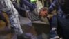 Russian police forcibly detain a man during street protests in Moscow on September 21 against the mobilization of reservists ordered by President Vladimir Putin.