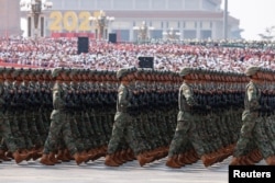Chinese soldiers march in unsion at the September 3 parade.