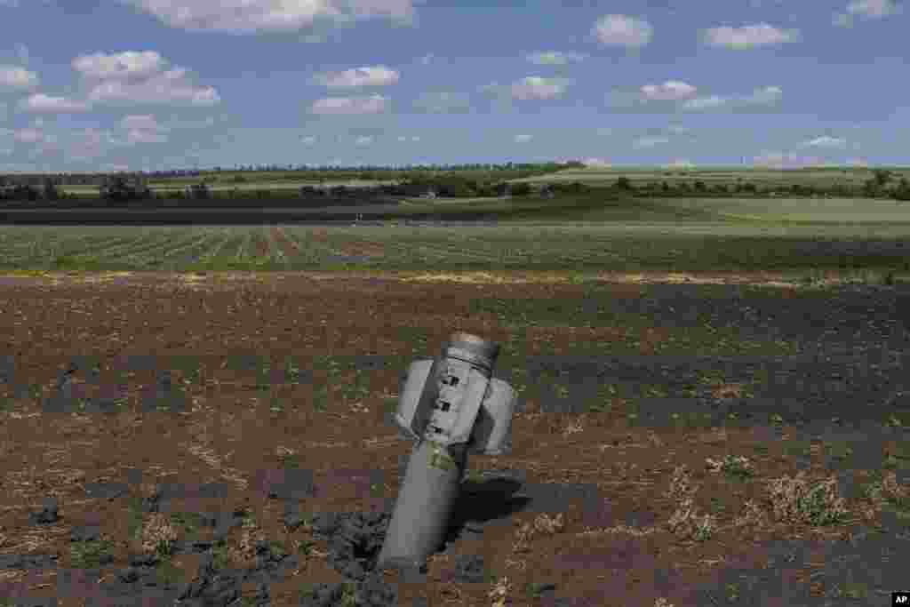A Russian projectile lies in a field near Soledar in eastern Ukraine on June 6. On April 29, Ukraine's Agriculture Ministry reported that nearly 30 percent of the country's farmland is now occupied, unsafe, or unable to be farmed. Bread prices have increased in some of the world's poorest and most vulnerable countries as a result of Russia's invasion.
