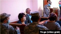 Natalia Ilychova (left) and Iveri Melashvili appear in a Tbilisi court on October 7.