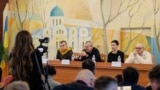Belarusian opposition leader Viktor Babariko (C-L) speaks next to Belarusian opposition leaders Vladimir Labkovich (L), Maria Kolesnikova (C-R) and Alexandr Feduta (R) during a press conference at an undisclosed location in Ukraine on December 14, 2025, a