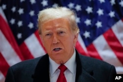 Fostul președinte american, Donald Trump, vorbește în timpul unei conferințe de presă, după o audiere preliminară la tribunalul penal din Manhattan. New York, 25 martie 2024.