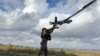 Ukrainian serviceman launches a reconnaissance drone near the frontline town of Pokrovsk