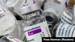 FILE PHOTO: Empty vials of Oxford/AstraZeneca's COVID-19 vaccine are pictured amid a vaccination campaign in Bierset, Belgium March 17, 2021.