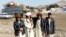 FILE: Some displaced Waziristan residents posing for a photo near the Gulan camp in Afghanistan's southeastern province of Khost.