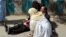 A doctor treats an injured lawyer at the scene of a suicide attack in the southwestern Pakistani city of Quetta. The August 8 attack killed 75 people. Most victims were lawyers.