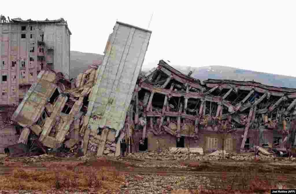 Many of the region's buildings cracked at their base, leading to some structures toppling like felled trees.