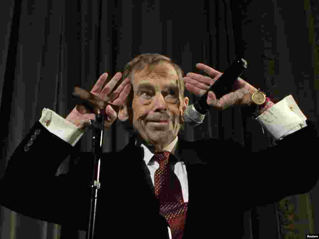 Havel waves to the audience after a premiere of his new movie "Leaving" in Prague in March 2011.
