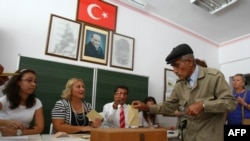 A man casts his referendum vote in Ankara.