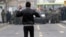 An Iranian opposition protester faces security forces during clashes in Tehran in December 2009, following the reelection of Mahmud Ahmadinejad as president.