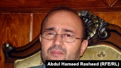 Abdul Qadir Fitrat has fled his job as Afghanistan's central banker, and his country, fearing for his safety.