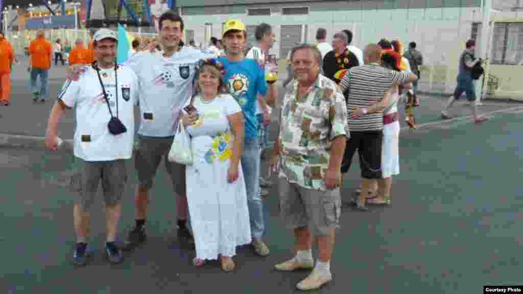 Toldina and Oleg pose with visiting German fans Thomas from Munich (left) and Volker from Berlin (second from left) who came for the Netherlands vs. Germany match on June 13. "It was a pity that they had to go back home," Toldina said.