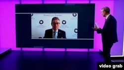 Former NATO chief Anders Fogh Rasmussen speaks to RFE/RL's Ray Furlong via video link. 