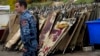 A policeman walks past blood-stained stretchers at a morgue in Stepanakert, the main city in Nagorno-Karabakh, on November 6.