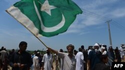 Pakistani and Afghan Pashtuns gather at a rally in Islamabad in July 2015. 