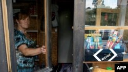 Vlasnica prodavnice u Leposaviću, fotoarhiv