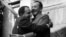 John Steinbeck (right) and Oleksandr Korneichuk, head of the Ukrainian Union of Writers, exchange hugs. Korneichuk was an informant, according to KGB documents.