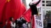 Supporters and critics of Chinese President Xi Jinping converge near the site of the 2023 APEC Summit in San Francisco. 