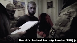 Seyran Saliev, a Crimean Tatar human rights activist, was detained at his home by Russia's FSB in October 2017. Since Russia seized Crimea from Ukraine, arrests, disappearances, and killings have driven ethnic Crimean Tatars from the peninsula. 