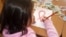 An HIV-infected child draws a Red Ribbon, the international symbol of HIV and AIDS awareness, at the Center for Maternity and Childhood in Shymkent in this 2010 photo.