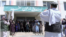 A group of Taliban fighters pose for a photo in the Zarghoo Shahr high school.