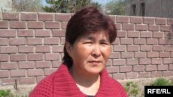 130 жастан аса ғұмыр кешкен қарағандылық Сахан Досованың немере қызы Нүкен Әлкешова.  Қарағанды, мамыр, 2010 жыл.